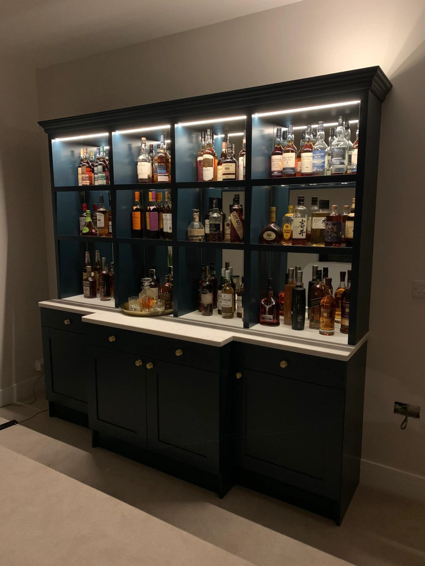 Breakfront Whiskey Fitted Bar and Wine storage unit with mirrors and lighting with a quartz top lit