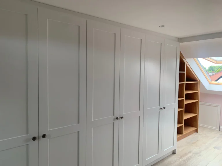Wardrobe in a loft with an angled bookcase